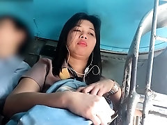 Curvy mature Asian lady voyeur upskirt in a public place