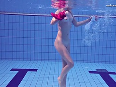 Hot Russian babe Elena Proklova swims naked