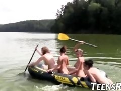 Gang of insane teenagers is having joy while swimming outdoor